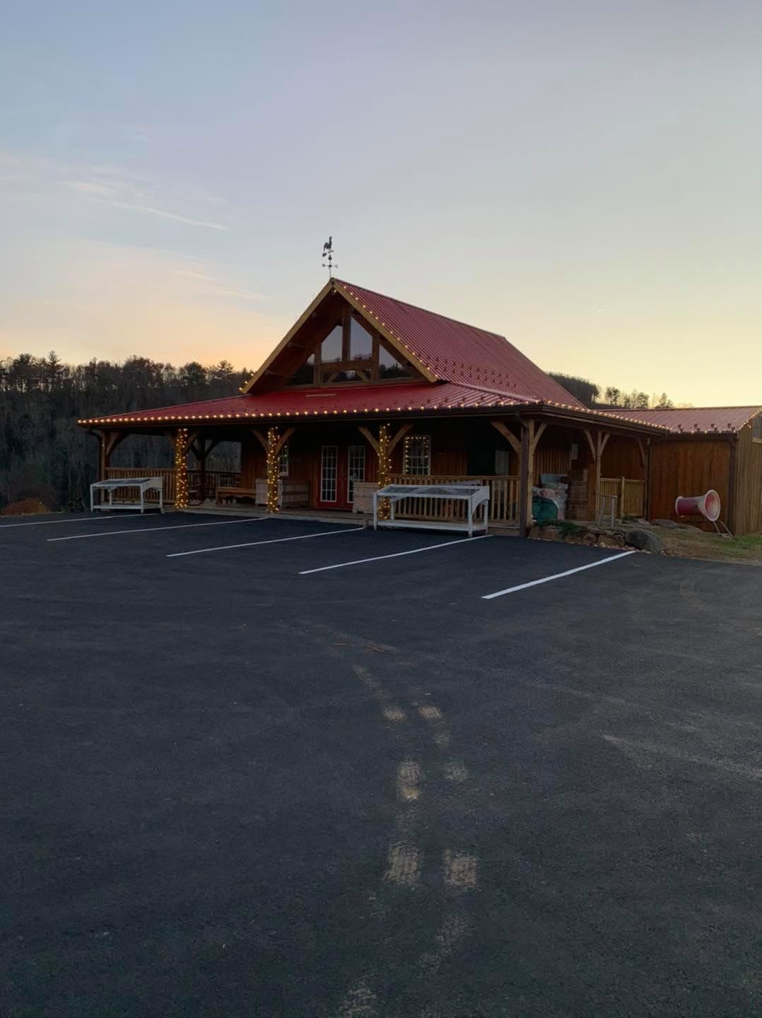 The Christmas store at dusk with its lights on